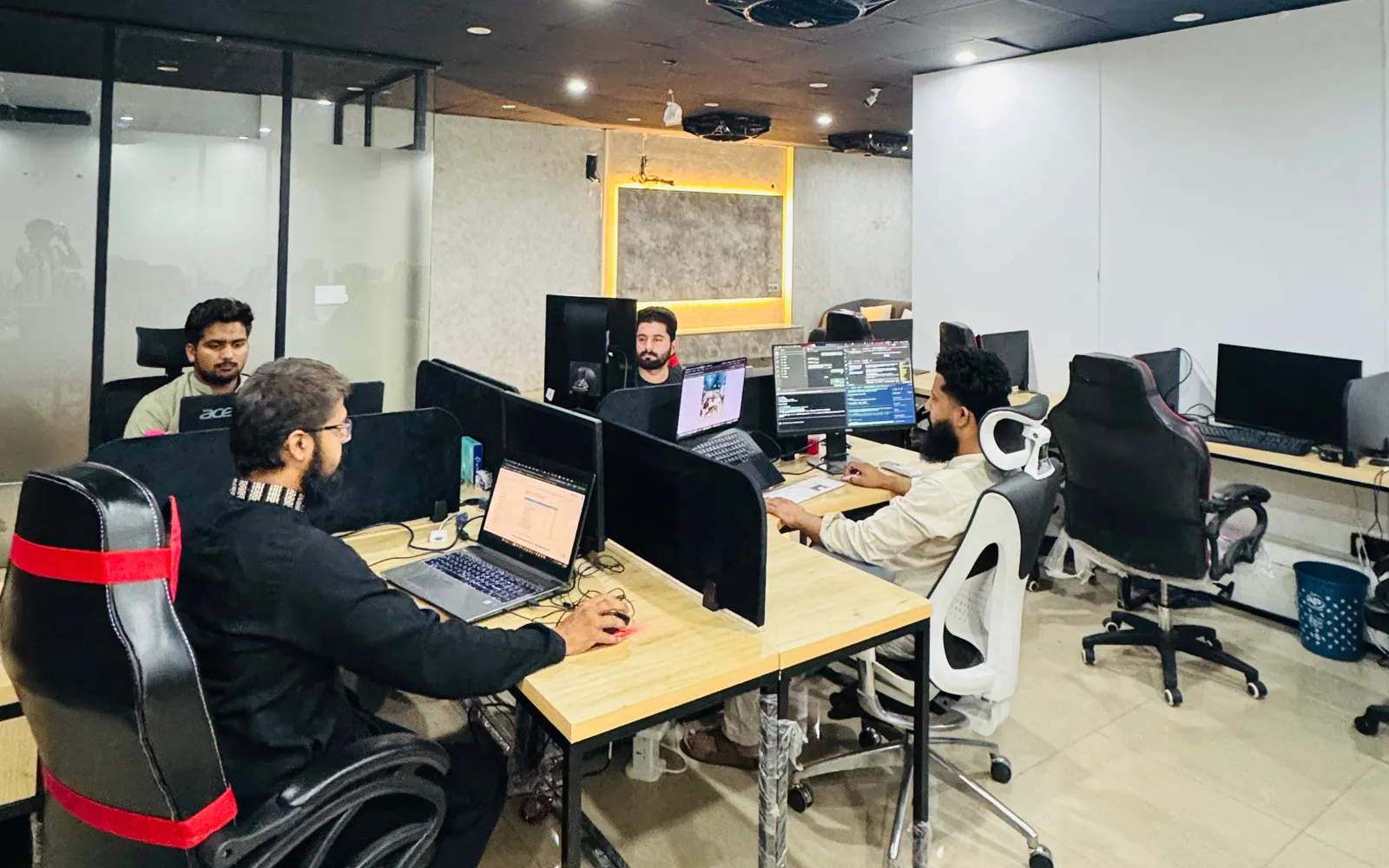 The Nafran team at their desks in the Lahore office